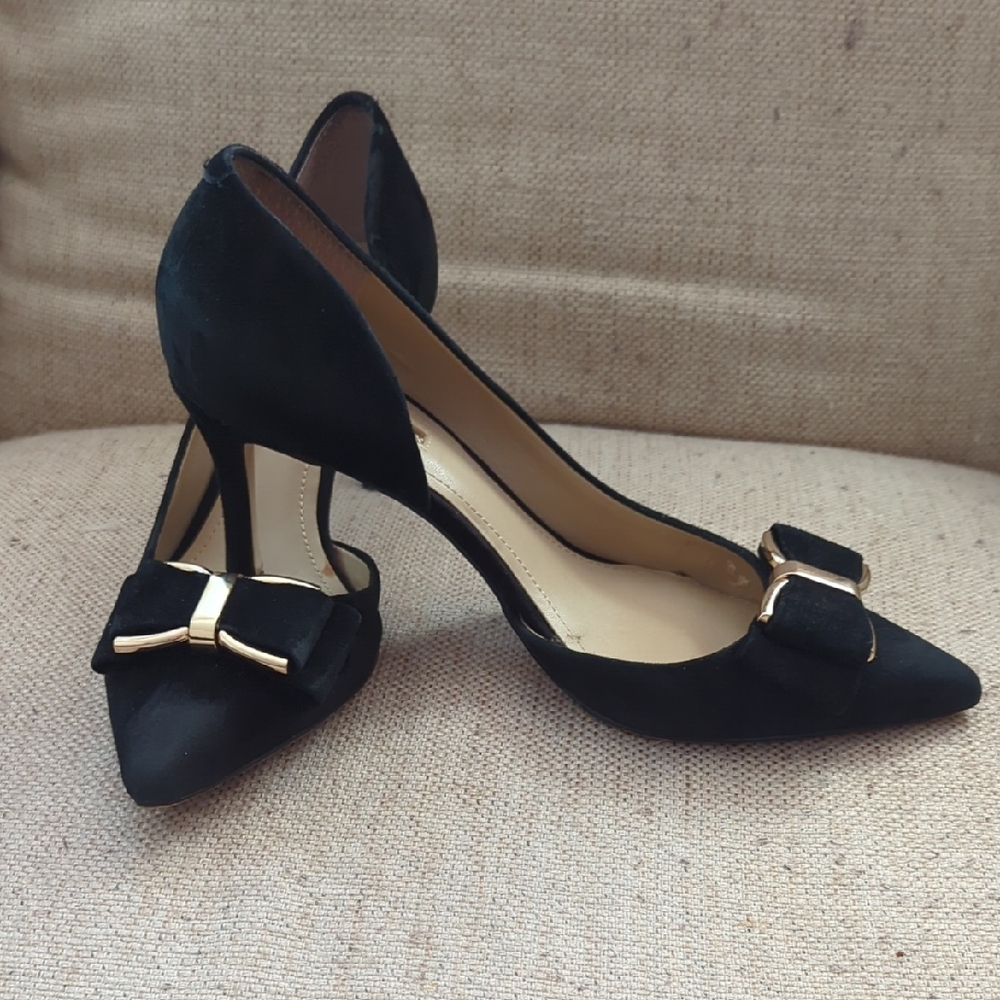 BCBGeneration Black Pointed-Toe Heels with Gold Bow Accent